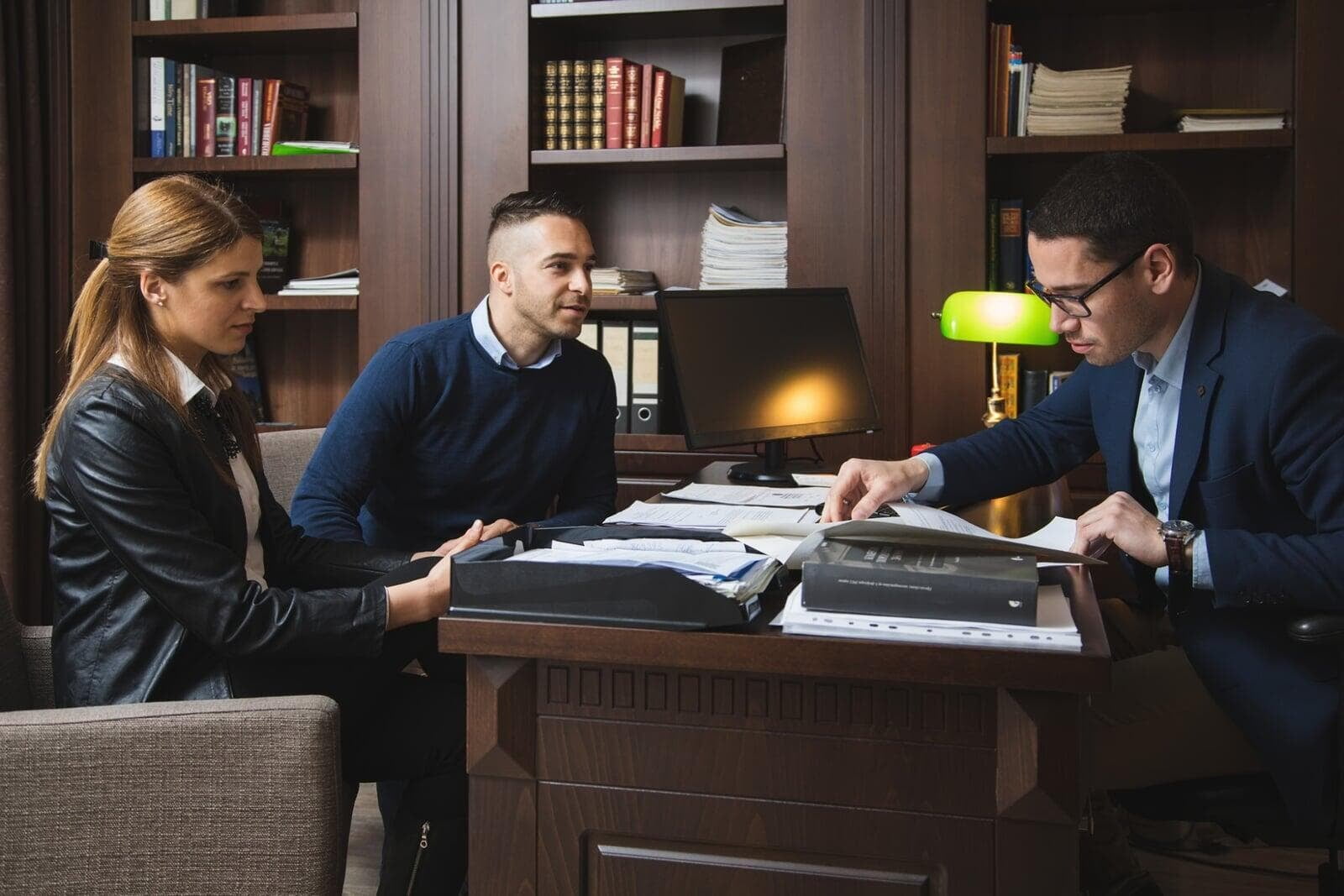 Picture of couple sat with their lawyer