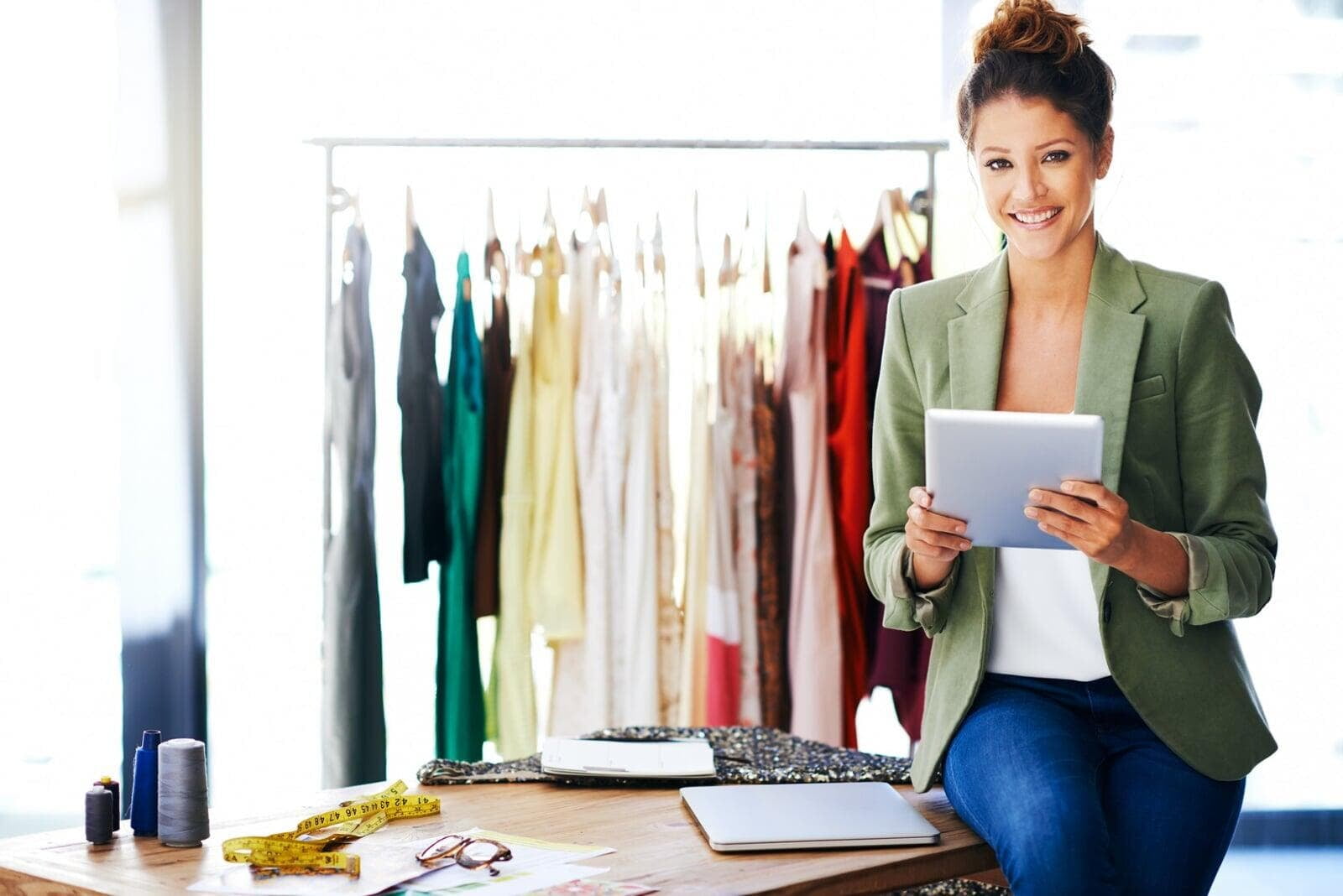 Fashion designer with wardrobe samples